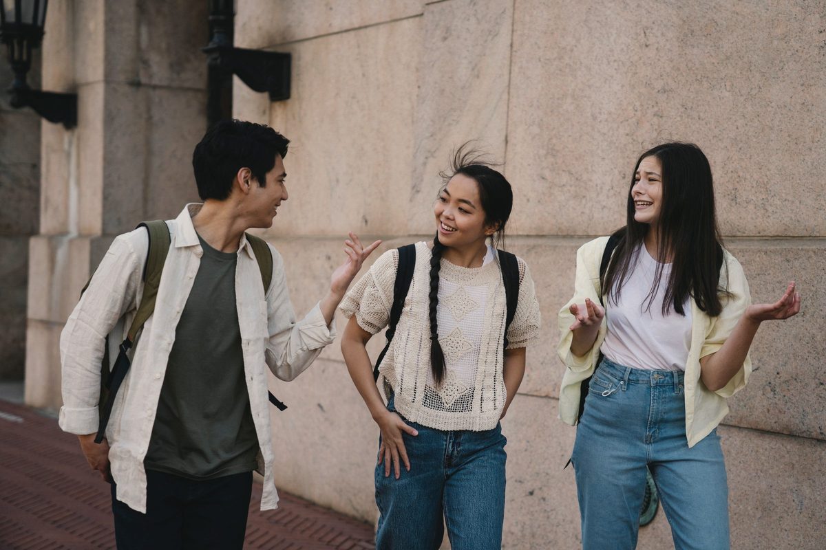 Group of friends talking while walking