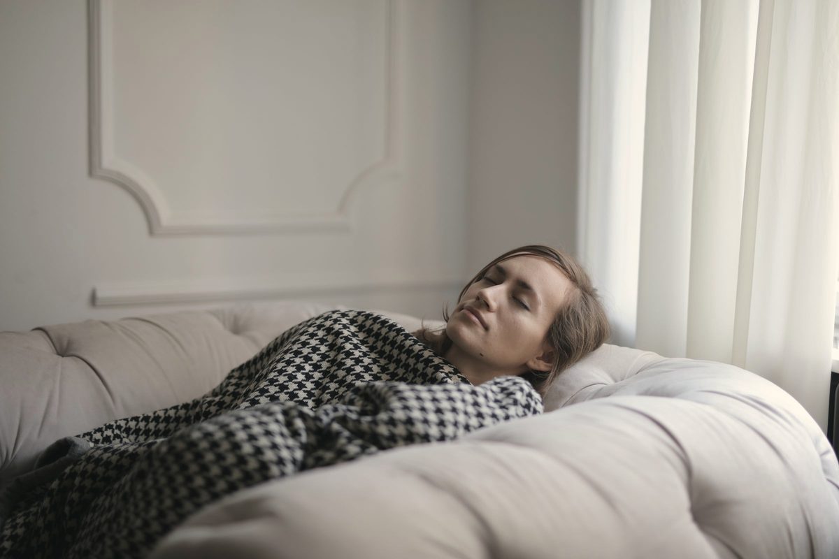 Woman lying on couch
