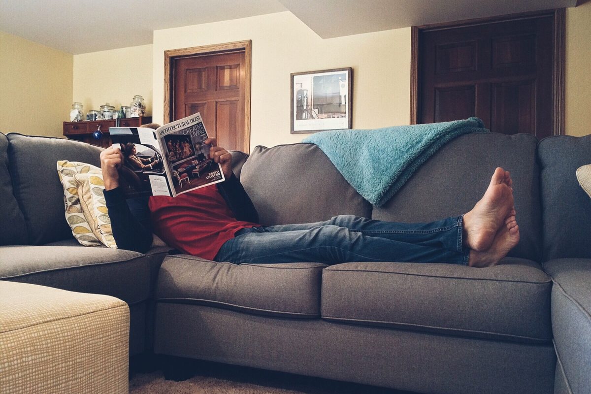 Woman lying on sofa