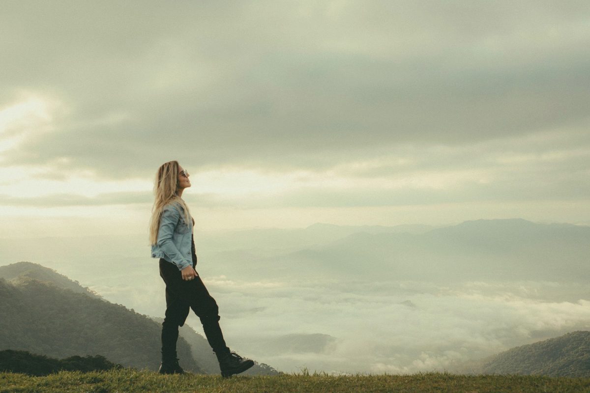 Smiling woman hiking in the mountains
