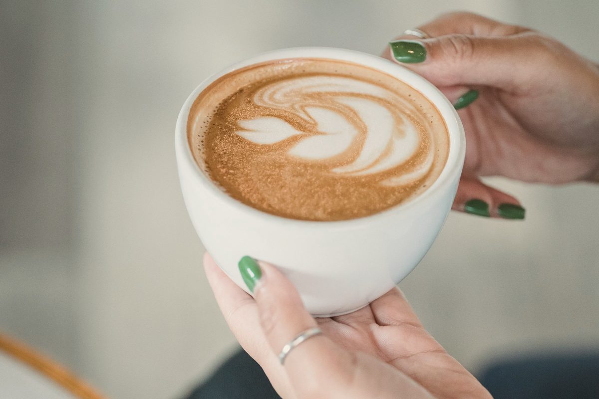 Woman relaxing in cafe with coffee
