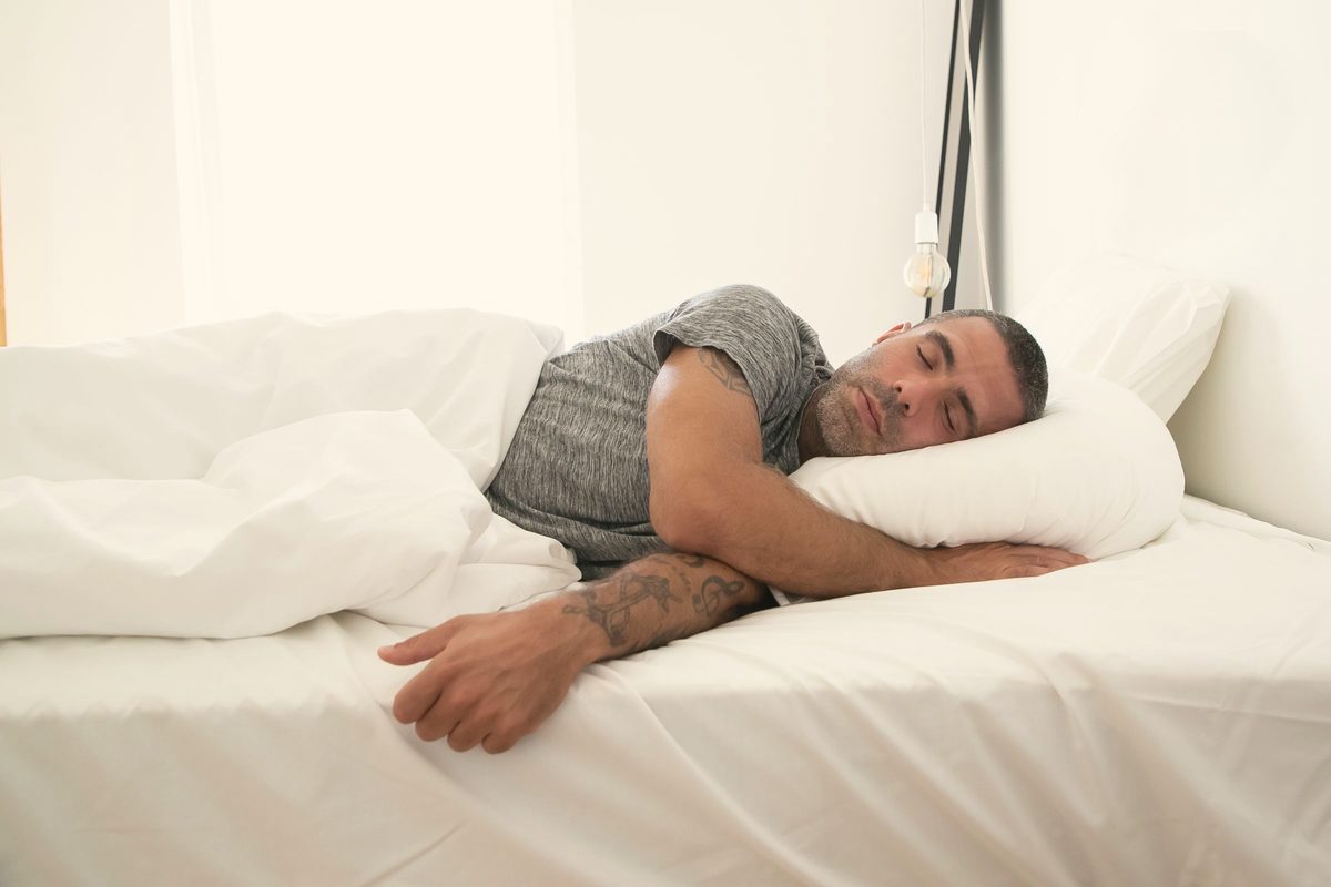 Man asleep in bed