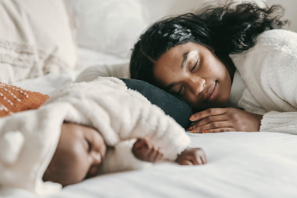 Mother and baby sleeping together