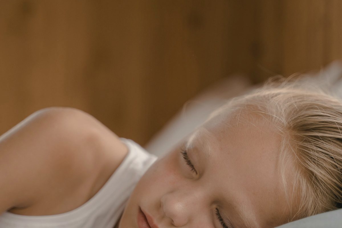 Child sleeping soundly in bed