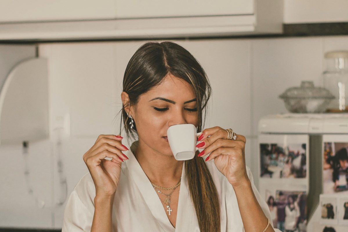 Woman eating breakfast in the kitchen