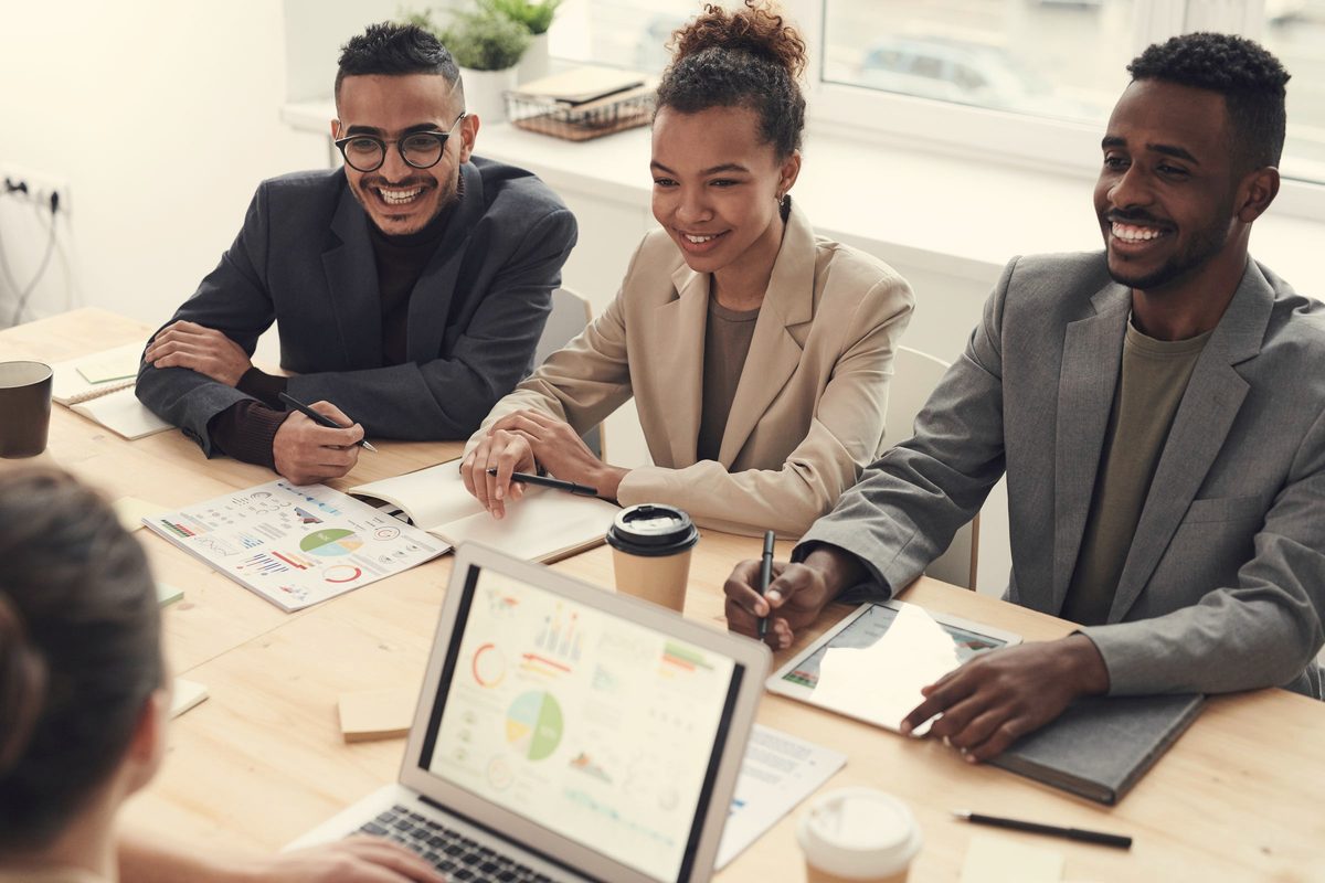 Colleagues smiling in a team meeting