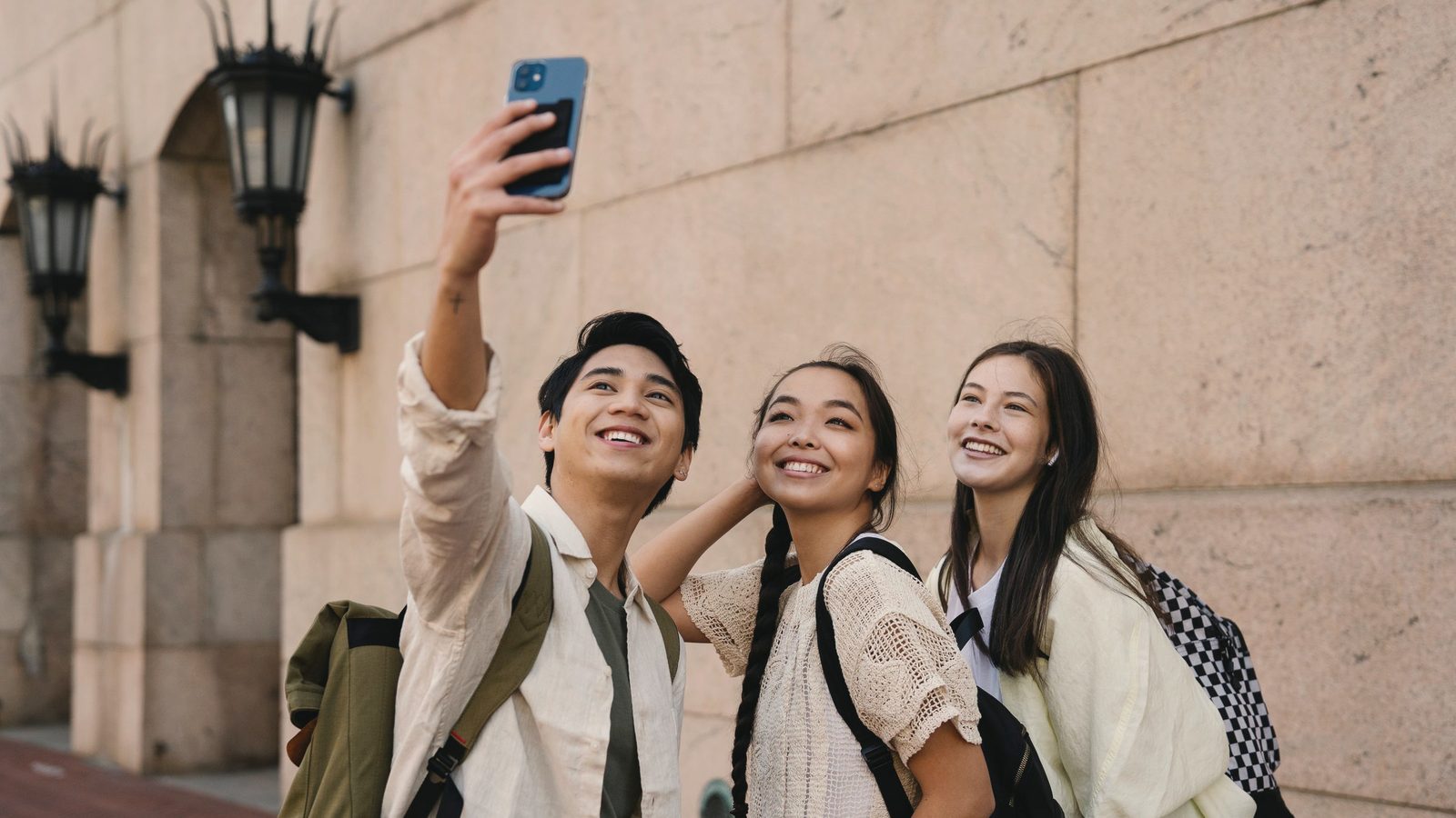 Friends taking a group selfie together