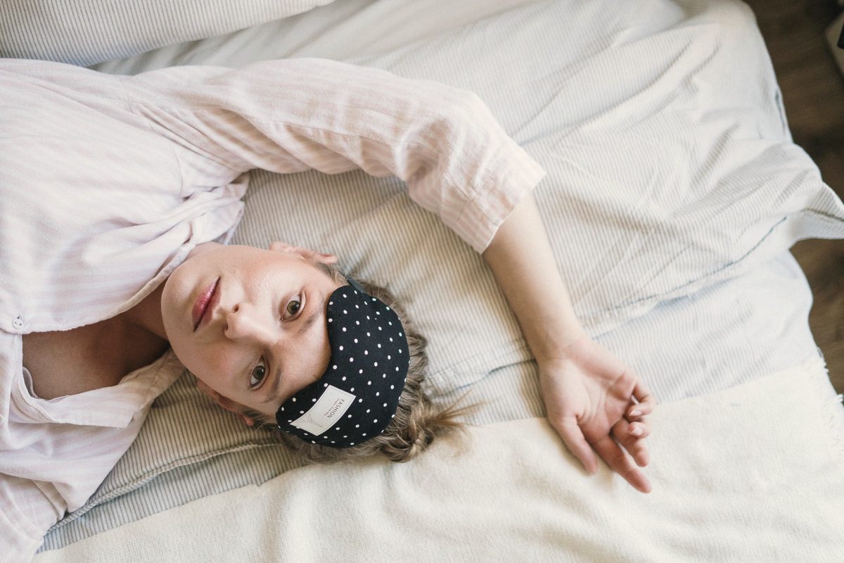 Woman lying awake on her bed