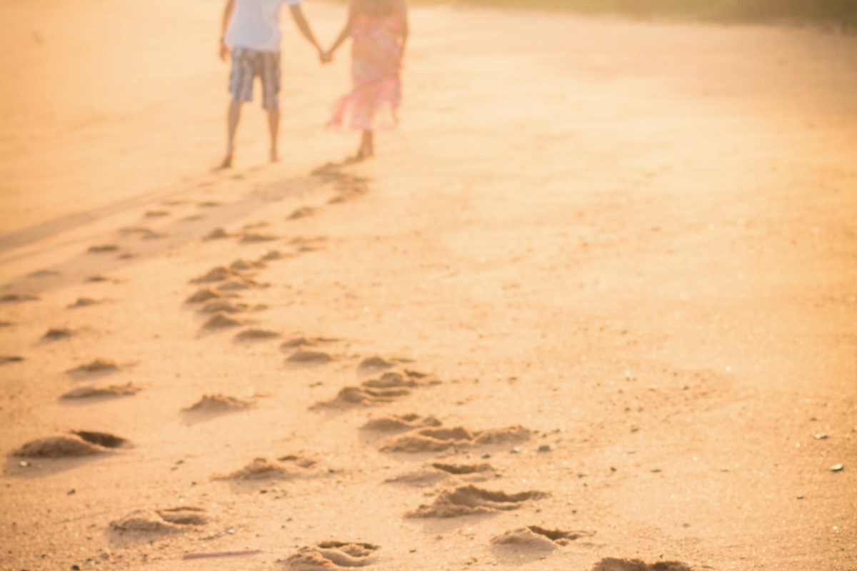 Footprints along a sandy beach