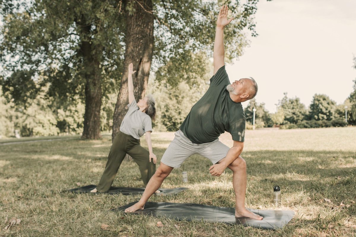 Older man doing slow exercises in the park