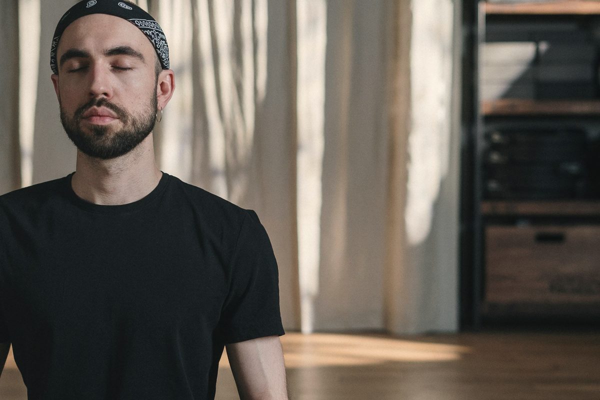Man sitting in quiet meditation with his eyes closed